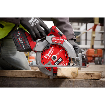 Milwaukee circular saw in use on a wooden plank with a blurred construction site background