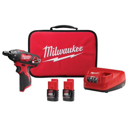 Milwaukee tool kit with drill, batteries, and charger on a white background