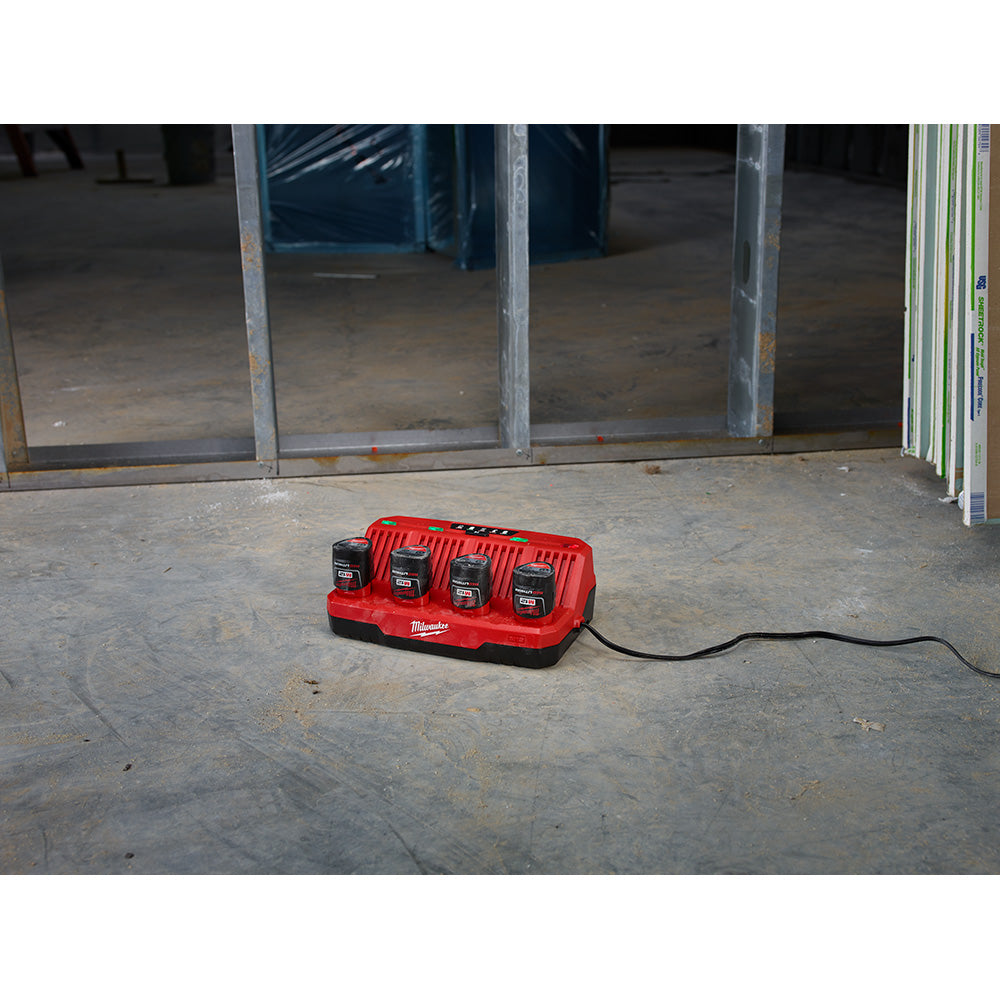 M12™ 4-Bay Sequential Charger charging batteries on the jobsite