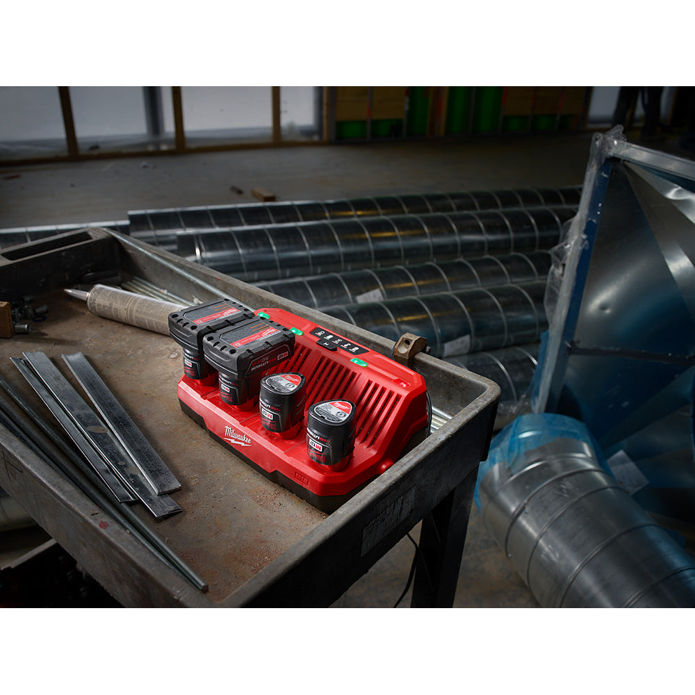 M12™ 4-Bay Sequential Charger charging batteries on the jobsite