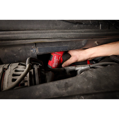 Person using a M12 FUEL™ 1/4" Right Angle Die Grinder under a vehicle