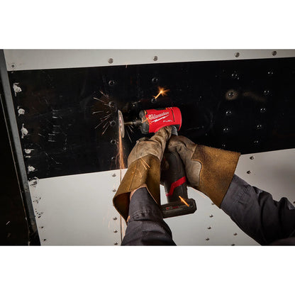 Person using a M12 FUEL™ 1/4" Right Angle Die Grinder on metal with sparks flying