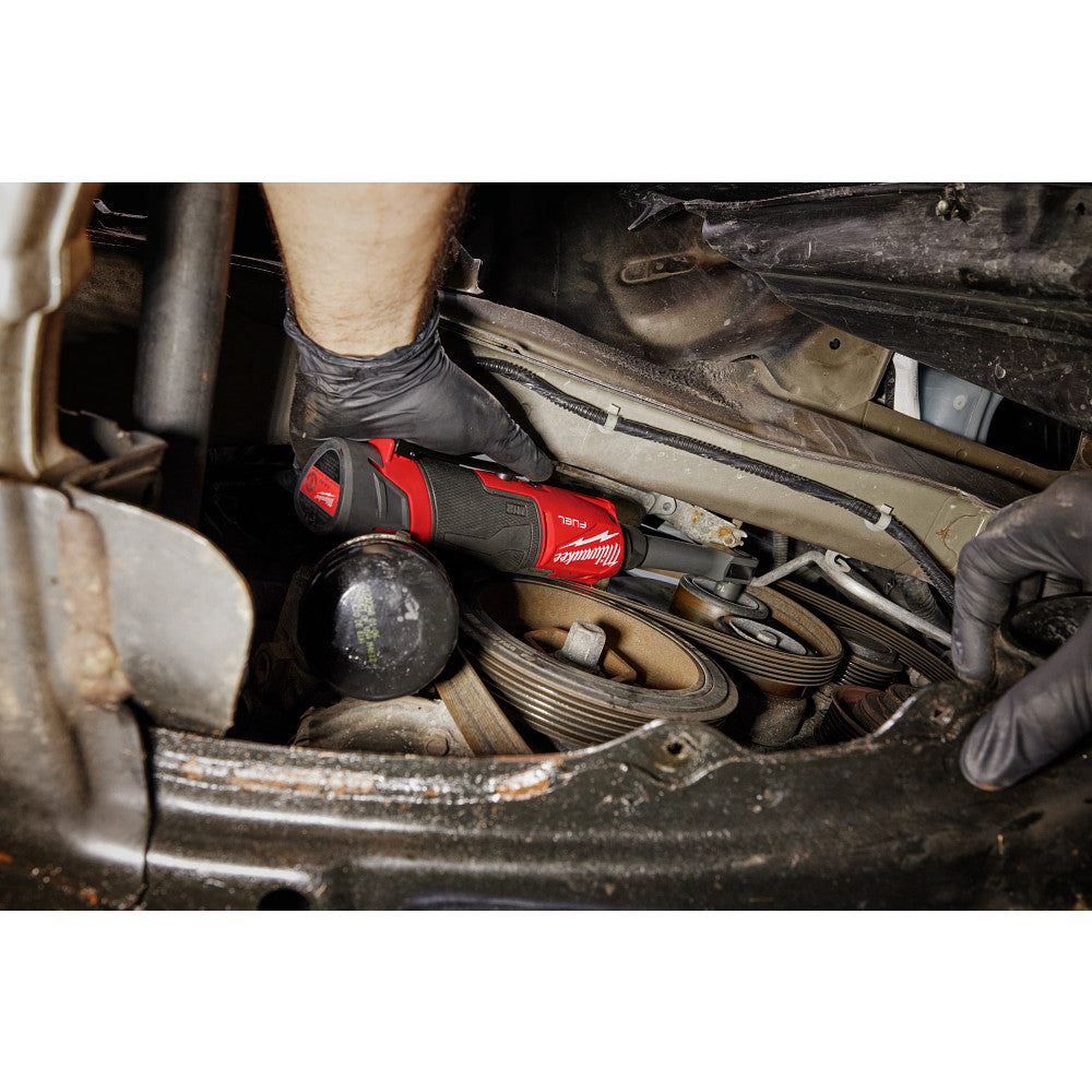 Person working on a car engine with M12 FUEL™ INSIDER™ Extended Reach Box Ratchet. 