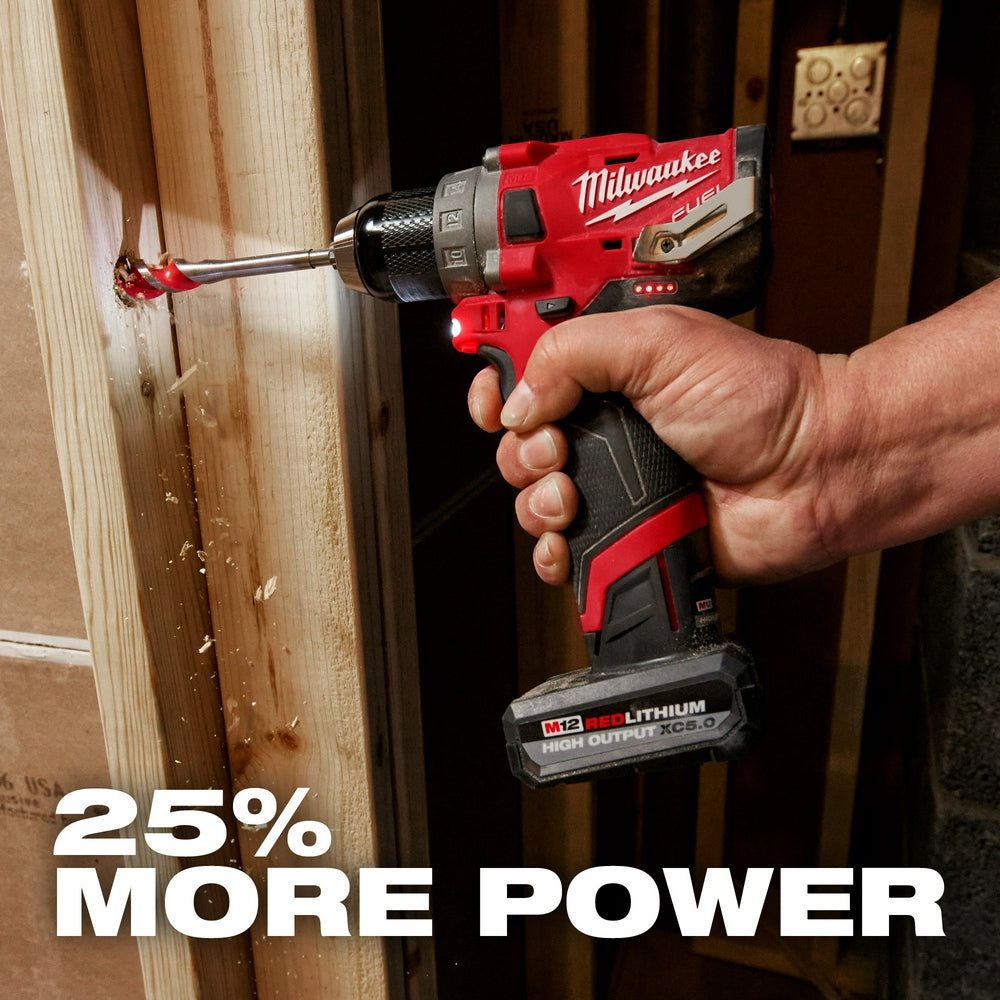 Person using a M12™ REDLITHIUM™ HIGH OUTPUT™ XC5.0 Battery Pack to drill into wood with text '25% More Power'.