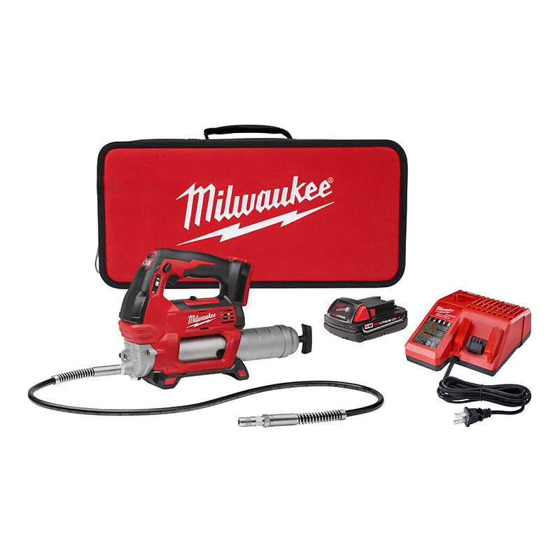 Milwaukee M18 2-Speed Grease Gun kit including the gun, a battery, a charger, and a carrying case with the Milwaukee logo on them.