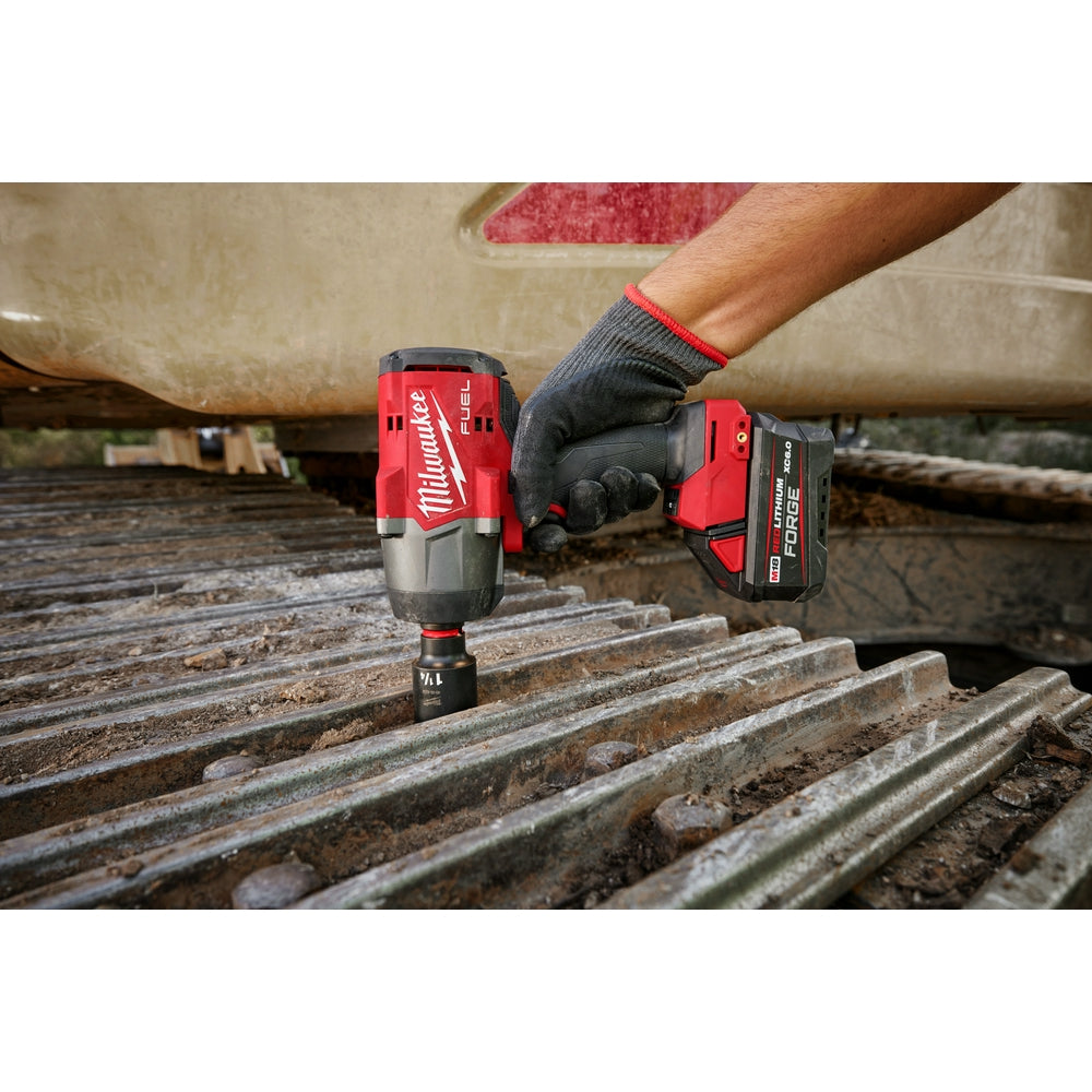 Person using a M18 FUEL™ 1/2" High Torque Impact Wrench w/ Friction Ring on a construction site.