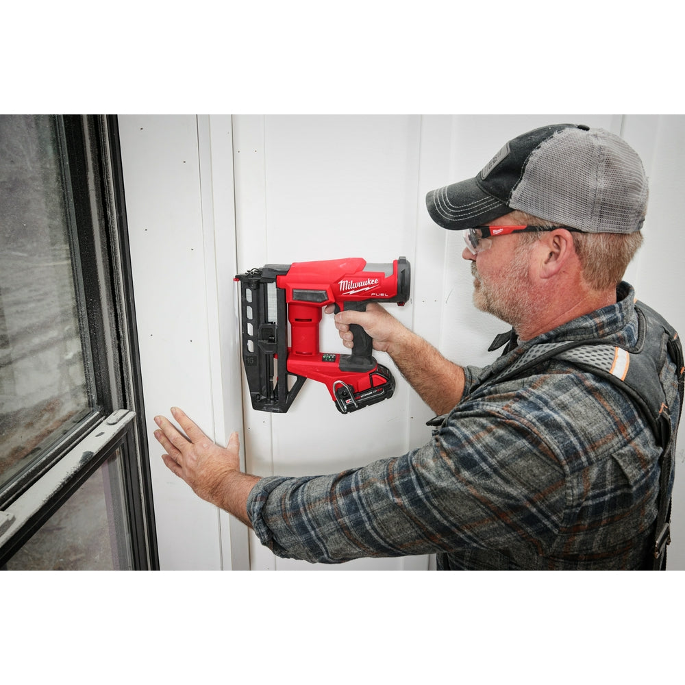 Person using aM18 FUEL™ 16 Gauge Straight Finish Nailer on a wall
