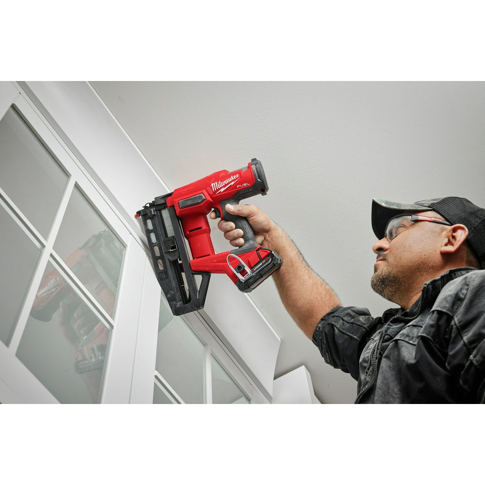 Person using a M18 FUEL™ 16 Gauge Straight Finish Nailer in a construction setting