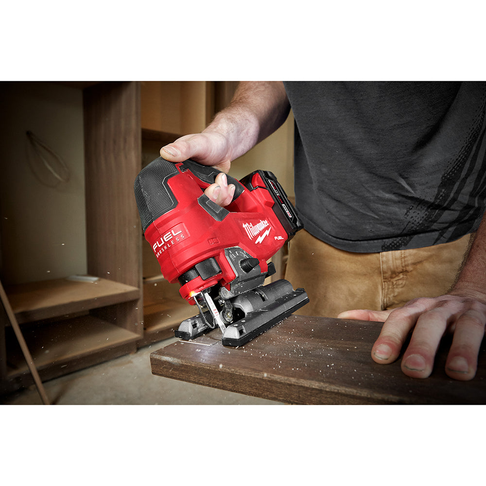 Person using a M18 FUEL™ D-handle Jig Saw on a wooden surface