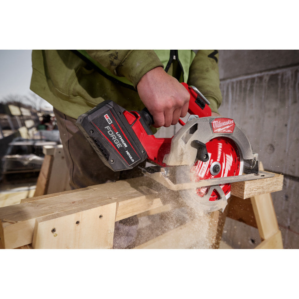 Person using a cordless circular saw with a M18™ REDLITHIUM™ FORGE™ HD12.0 Battery Pack to cut wood.