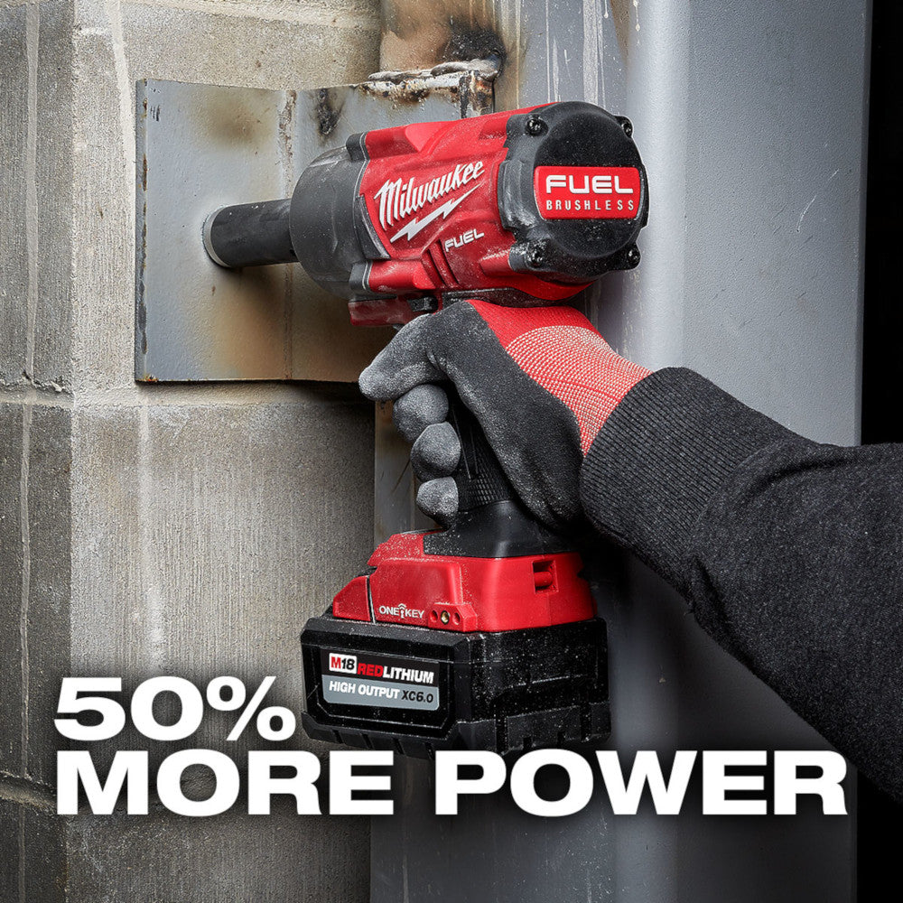 Person using a Milwaukee power tool and battery on a metal surface. 50% More Power