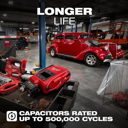 Red tools and equipment in a garage with a vintage car, emphasizing longer life and capacitor ratings.