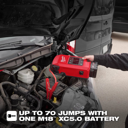 Person using a red Milwaukee jump starter on a car battery with text about battery capacity.