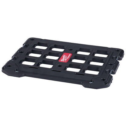 A black PACKOUT modular storage system mounting plate with metal reinforced mounting holes.