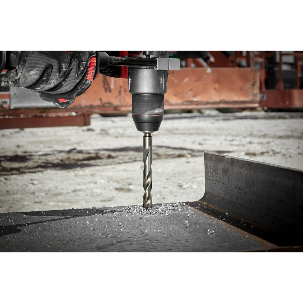 Drill bit in action on a metal surface.